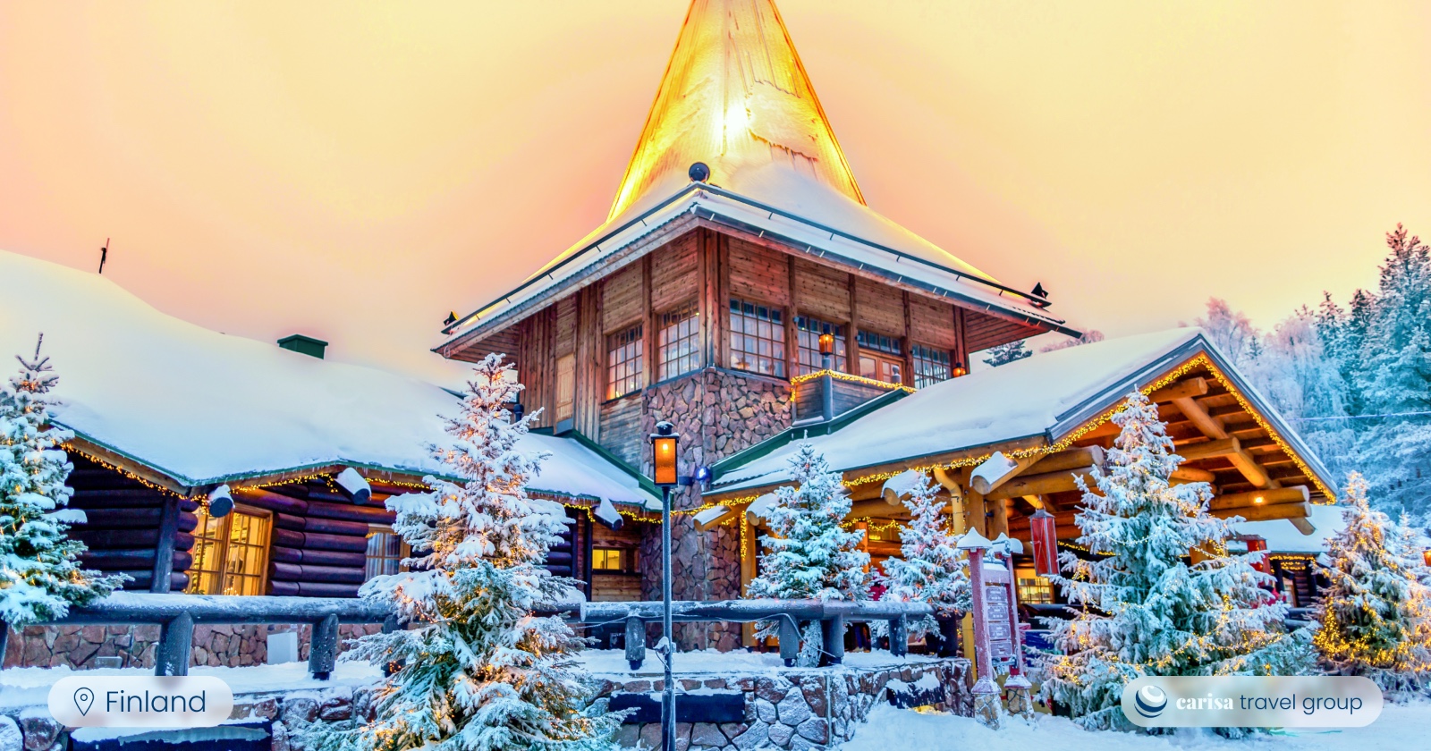 Santa Claus Office building from outside with snowy Christmas trees. Photo Carisa Travel Group.