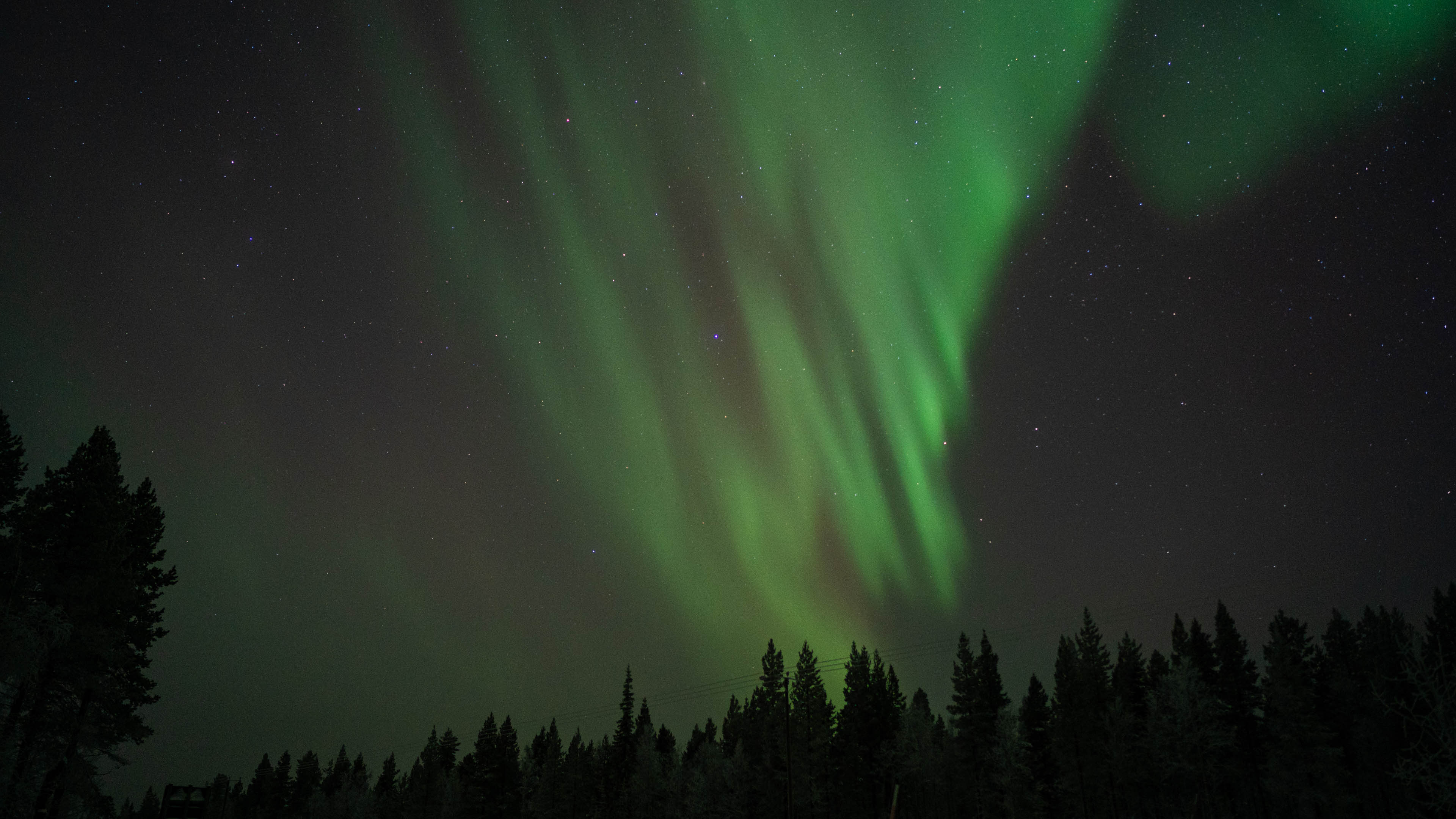 Green Northern lights in Rovaniemi, Lapland, Finland