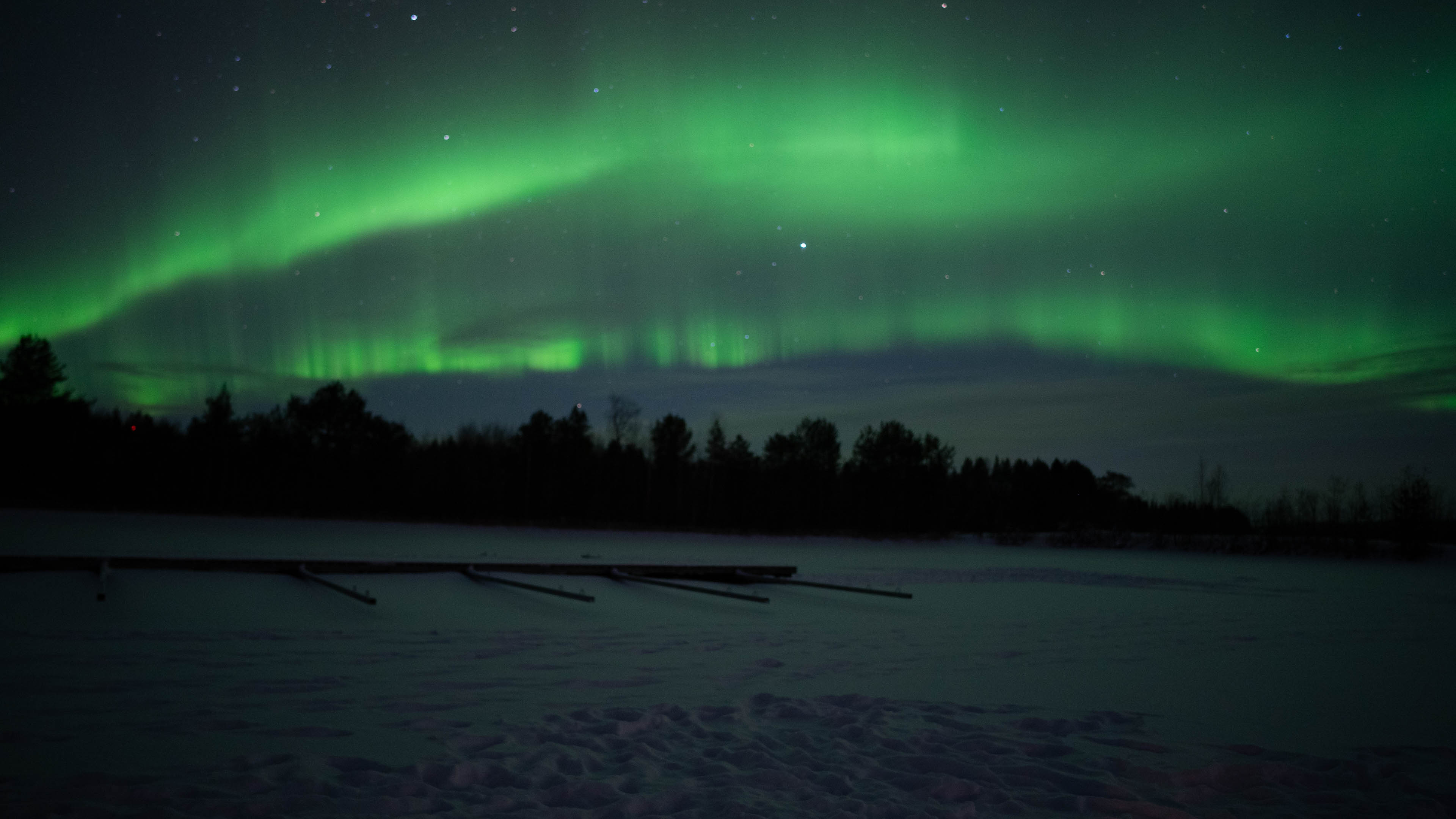 Green northern lights in the sky in Rovaniemi, Lapland, Finland