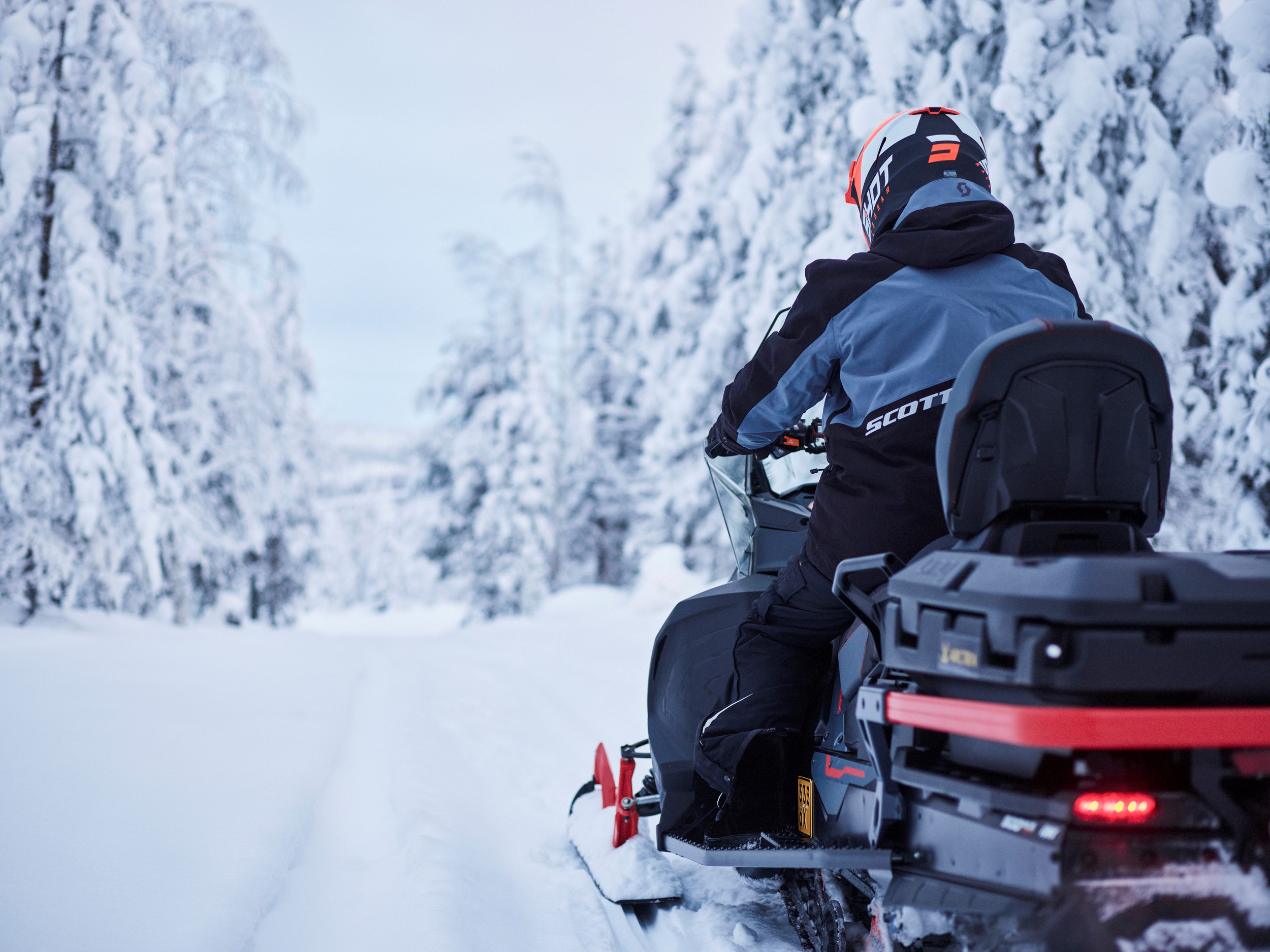 a person on a snowmobile in a snowy forest, Arctra DMC