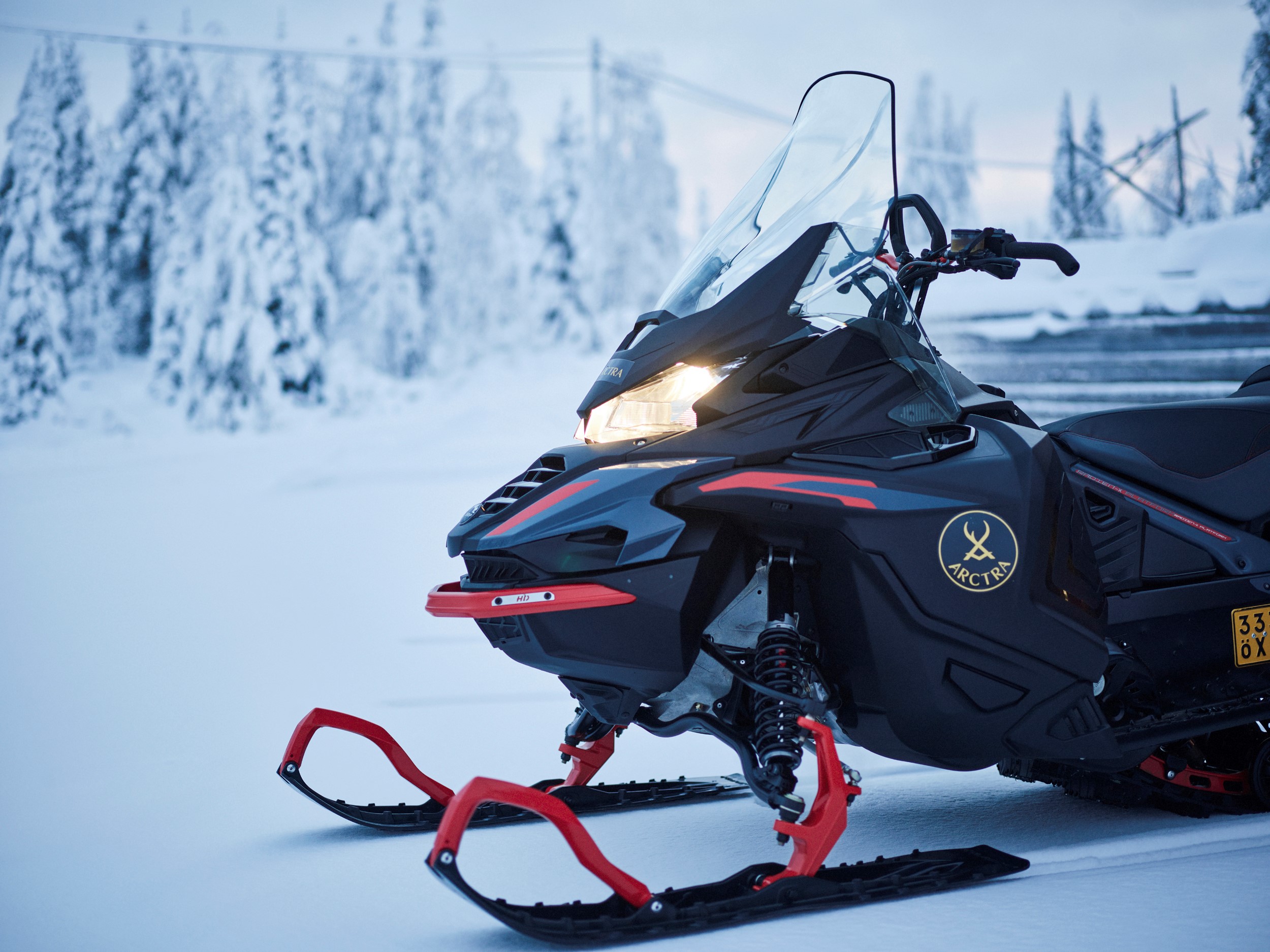 a snowmobile parked in the snowy forest, Arctra DMC