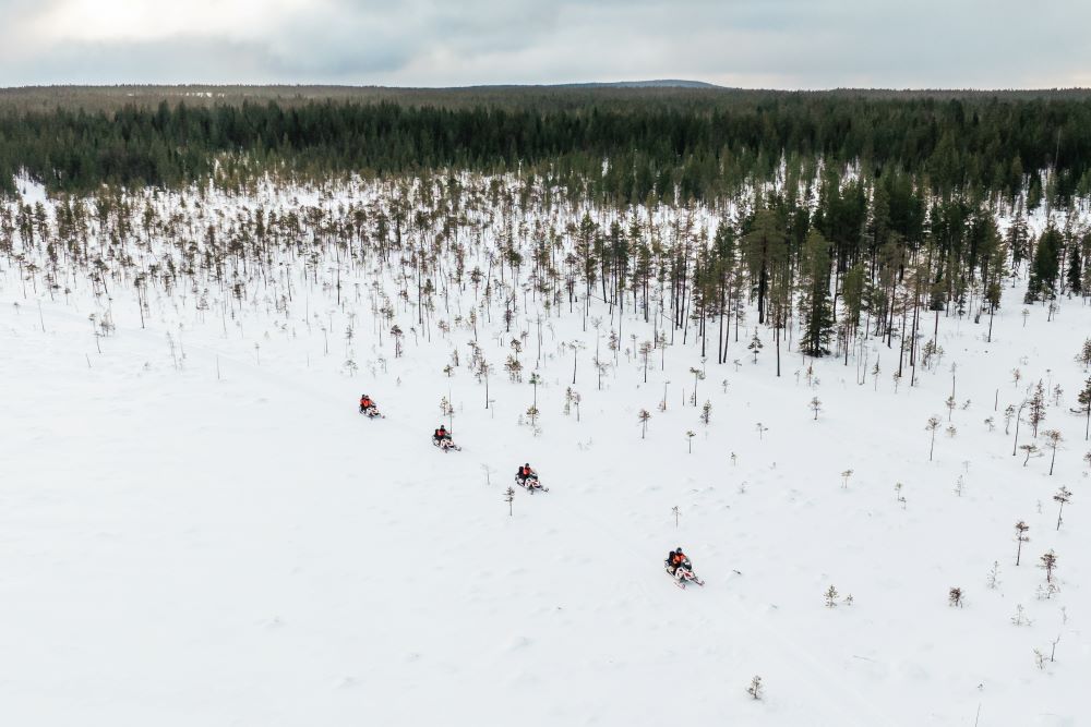 electric snowmobiling in spring winter